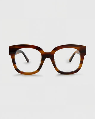 Tortoiseshell eyeglasses on a light gray background